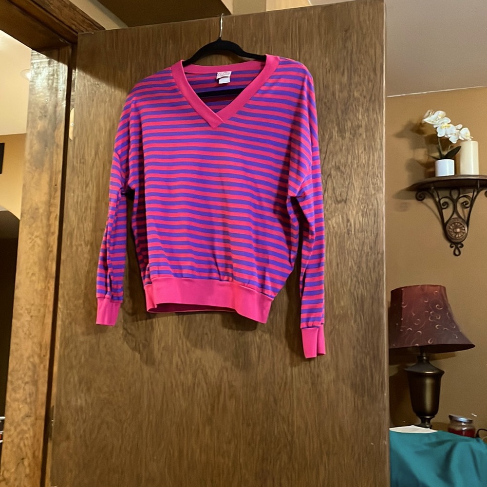 Lightweight pink with purple stripes sweater.
